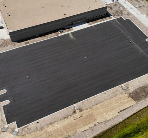 Bird's eye view of the completed asphalt parking lot at FedEx distribution center.