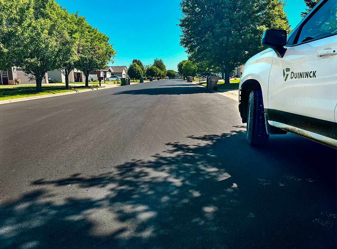 White Duininck truck on newly paved road