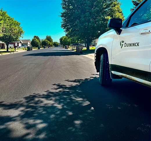 White Duininck truck on newly paved road